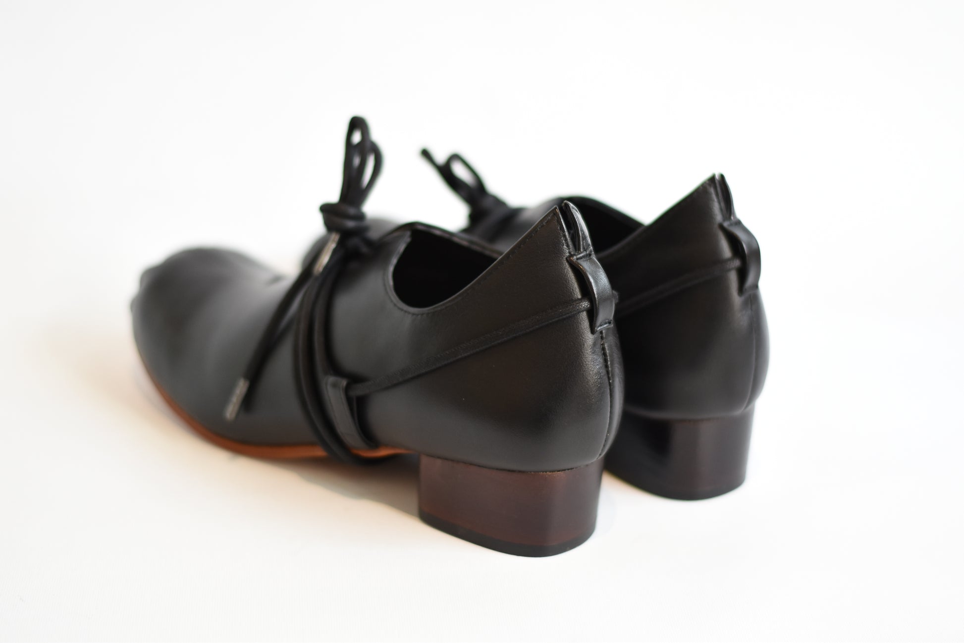 The Foundry Shoe - Black, paired with the Foundry’s unique pleated toe